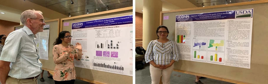 Two undergraduates presenting their work